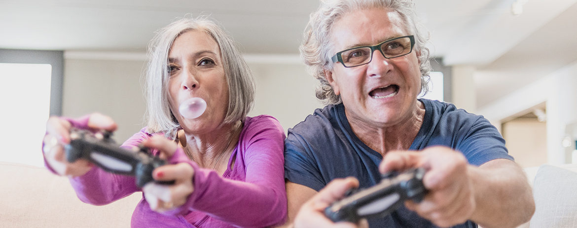 Retired couple playing video games