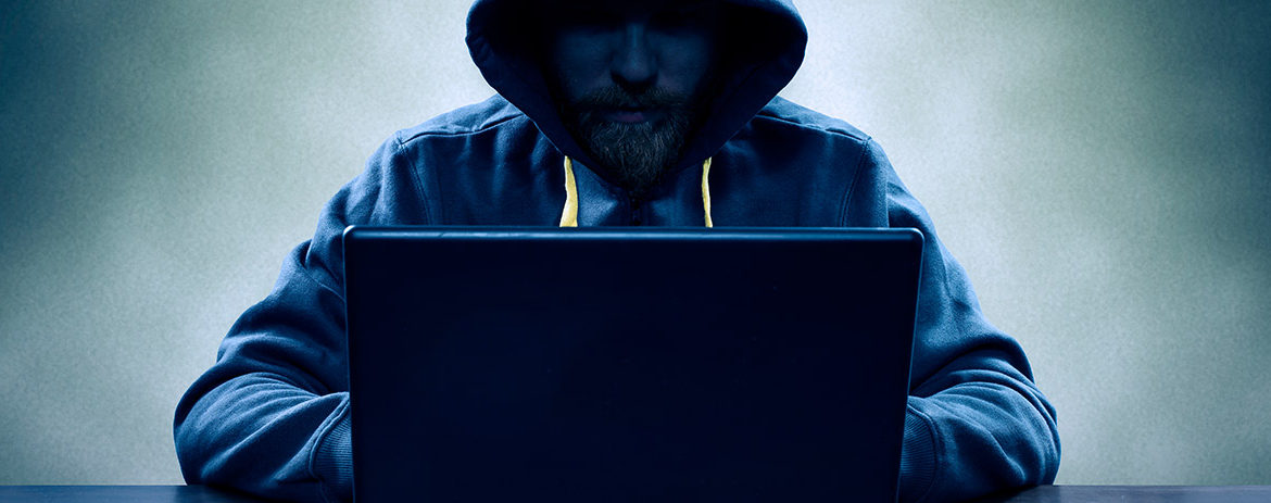 Suspect man on laptop