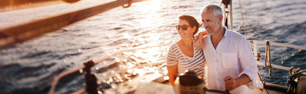 Retired couple enjoying sailing