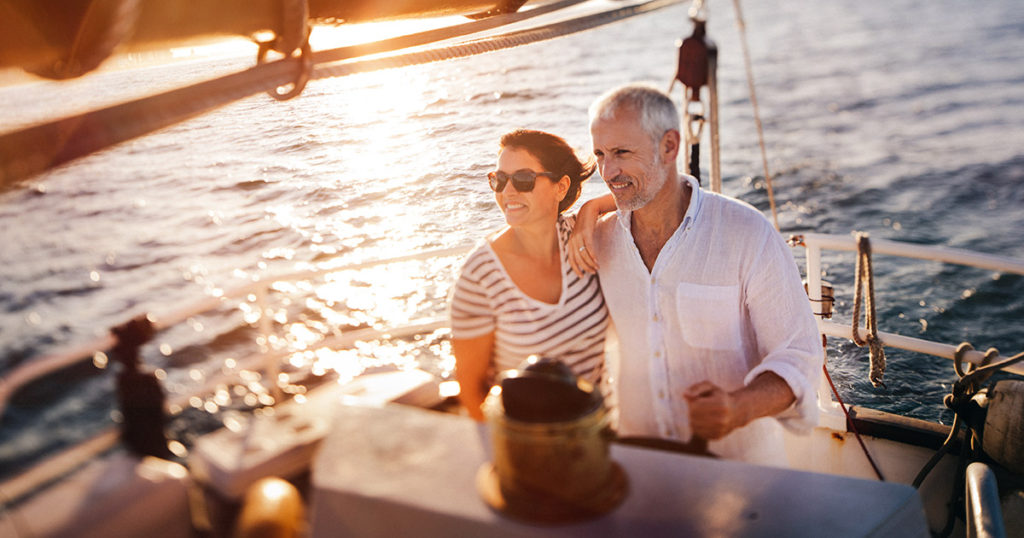 Retired couple enjoying sailing