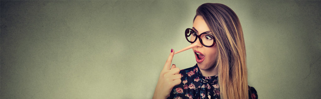 Young woman looking astonished at her growing nose