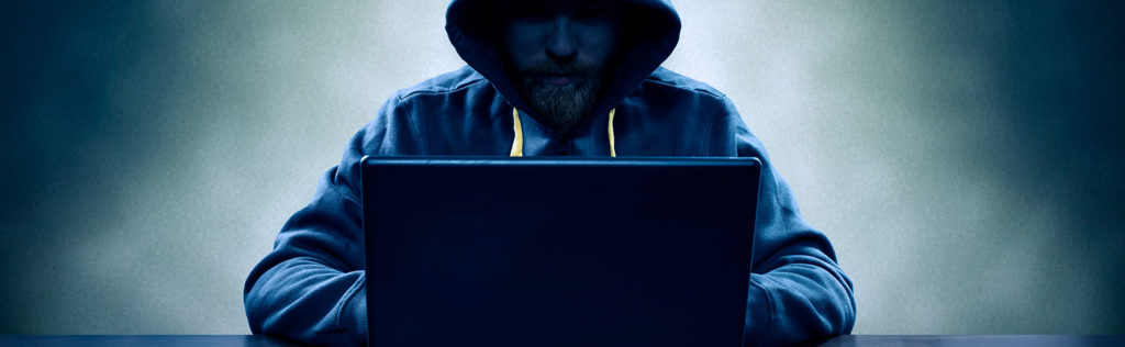 Suspect man on laptop