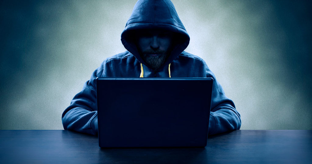 Suspect man on laptop