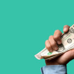 hand holding burning money